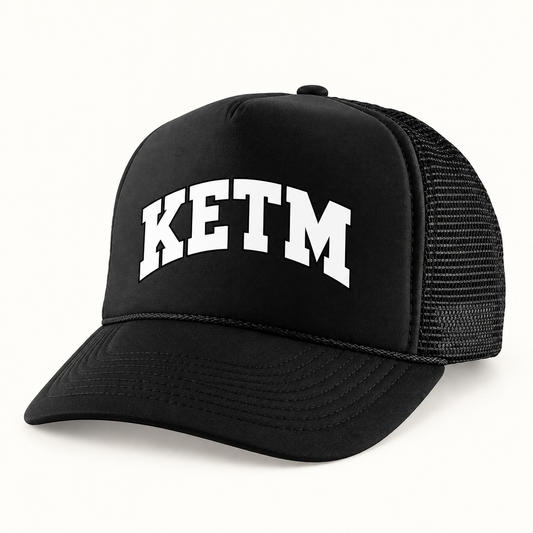 KETM foam-front trucker hat in Black, arched DTF logo mockup