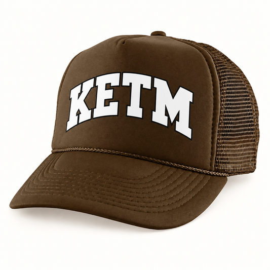 KETM foam-front trucker hat in Brown, arched DTF logo mockup