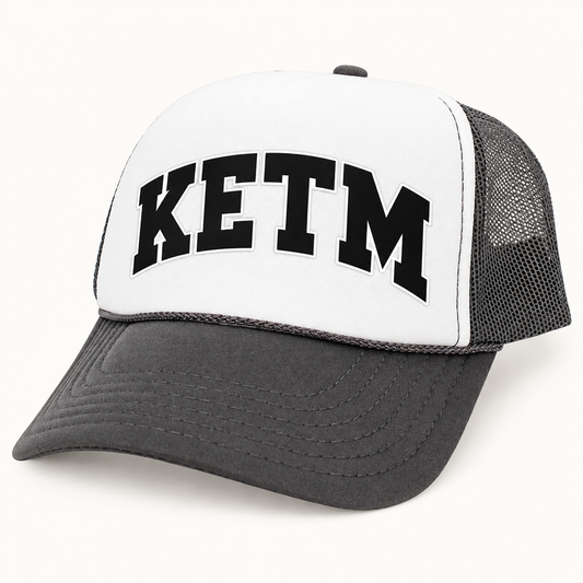KETM foam-front trucker hat in Dark Grey White, arched DTF logo mockup
