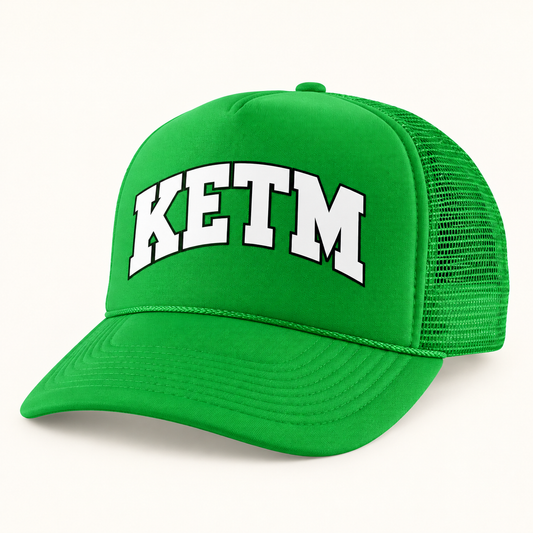 KETM foam-front trucker hat in Kelly Green, arched DTF logo mockup